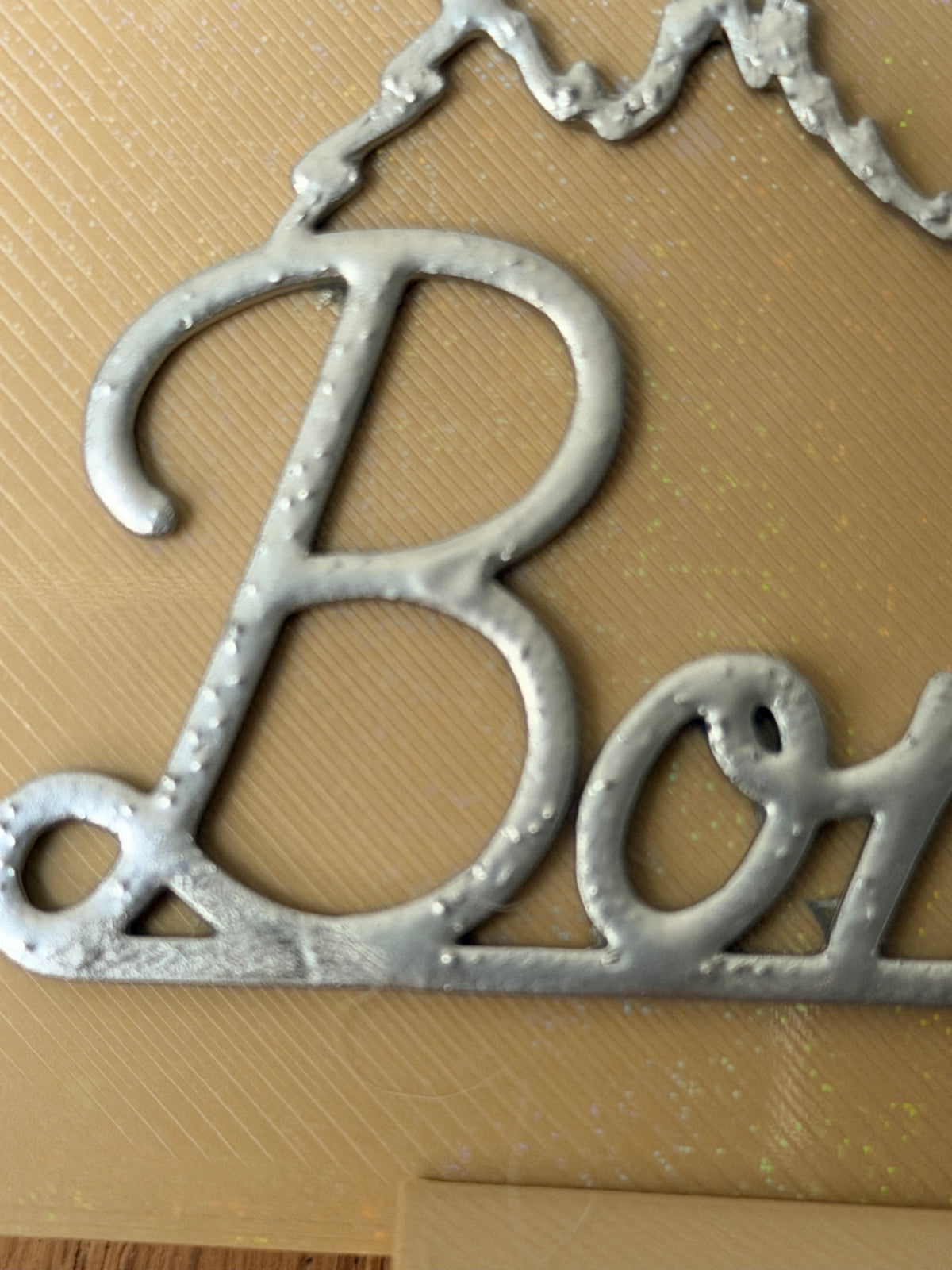 Echte detailfoto · zilver op beige